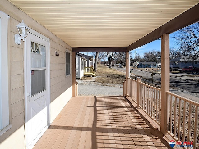 wooden terrace with a porch