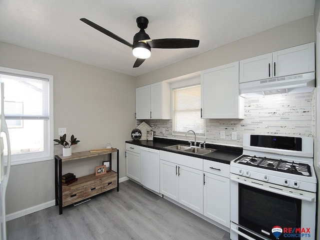 kitchen with ceiling fan, decorative backsplash, sink, white appliances, and white cabinets