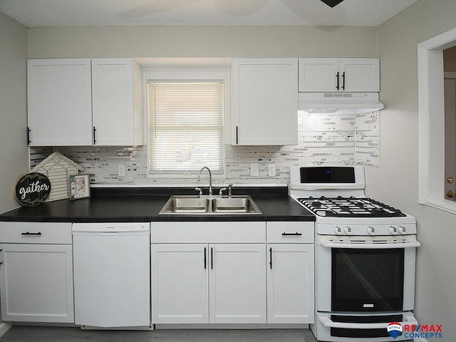 kitchen featuring tasteful backsplash, sink, white appliances, and white cabinetry