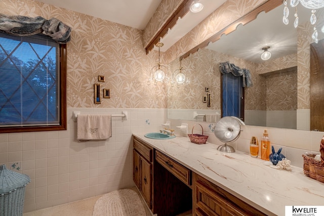 bathroom featuring tile walls and vanity