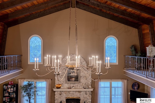 room details with wooden ceiling, a fireplace, and beamed ceiling