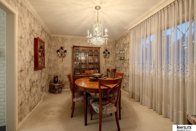 dining room featuring light carpet, a chandelier, and ornamental molding