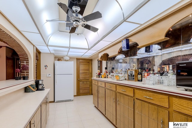 kitchen with ceiling fan and white refrigerator