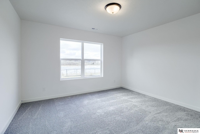 empty room featuring carpet flooring