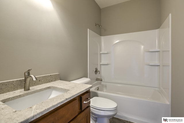 full bathroom with vanity,  shower combination, and toilet