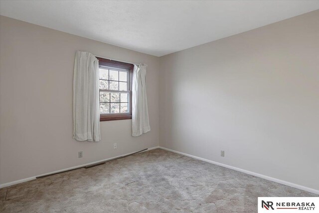 view of carpeted spare room