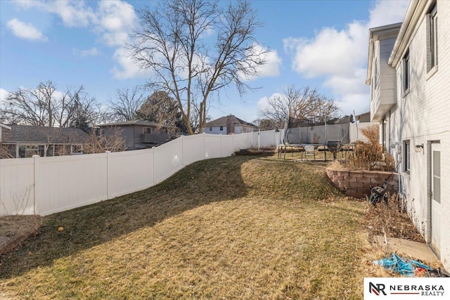 view of yard featuring a trampoline