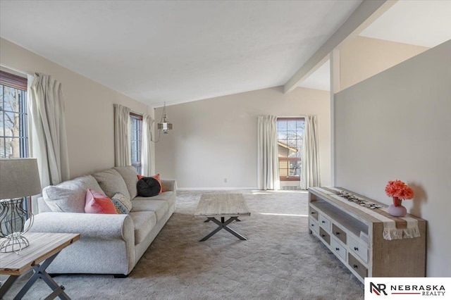 living room with carpet flooring and lofted ceiling with beams