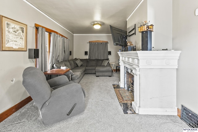 living room with crown molding and carpet flooring