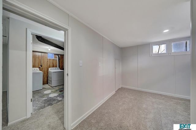 basement with light carpet and washer / clothes dryer