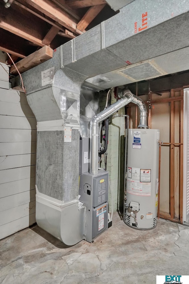 utility room with heating unit and gas water heater