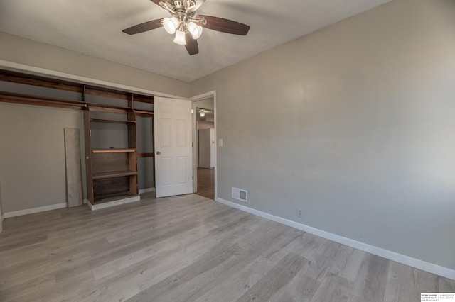 unfurnished bedroom with ceiling fan, light hardwood / wood-style floors, and a closet