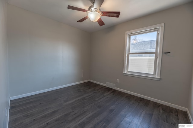 unfurnished room featuring ceiling fan and dark hardwood / wood-style flooring