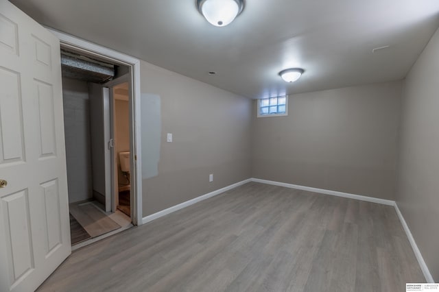 basement featuring light hardwood / wood-style flooring