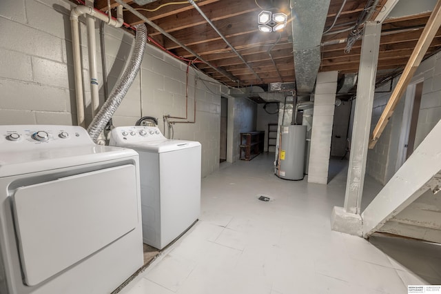 washroom with separate washer and dryer and gas water heater