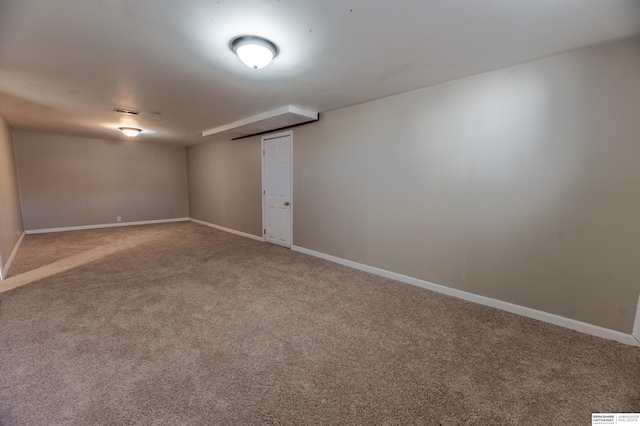 spare room featuring carpet floors