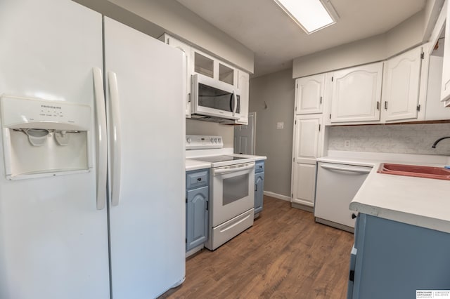 kitchen featuring white cabinets, dark hardwood / wood-style floors, sink, and white appliances