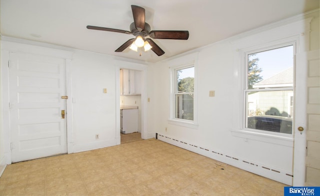 spare room with baseboard heating and ceiling fan