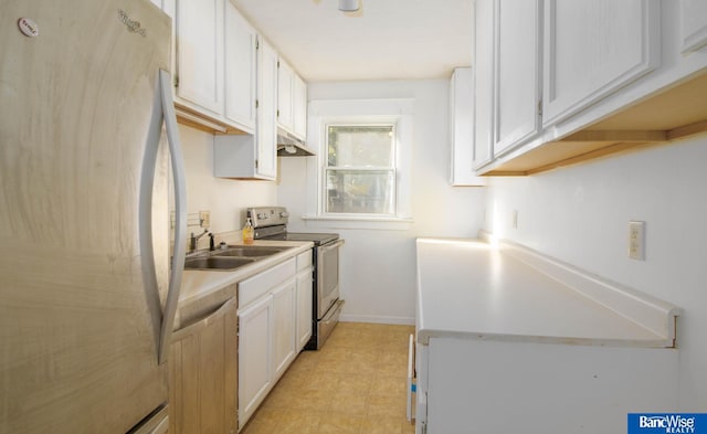 kitchen with white cabinets, appliances with stainless steel finishes, and sink