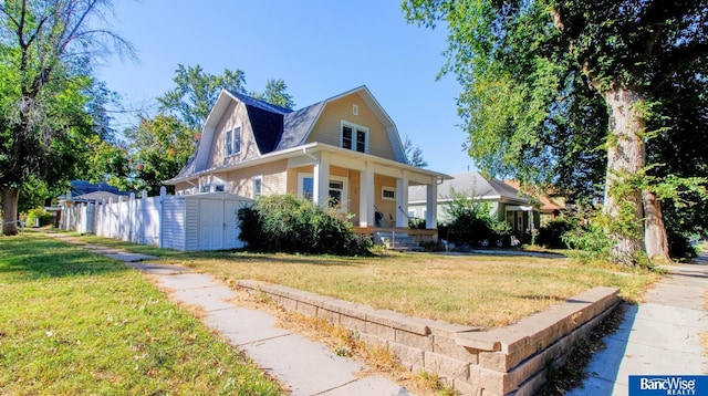 view of front of property with a front lawn and a porch