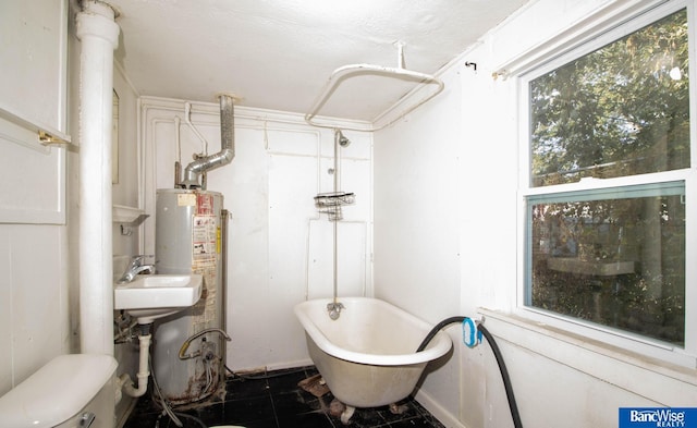 bathroom with toilet, a bath, and gas water heater