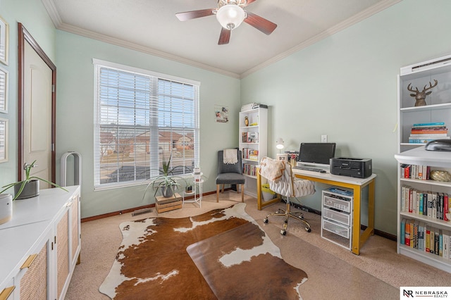 home office featuring light carpet, ceiling fan, and crown molding