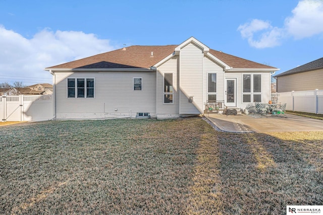 rear view of property featuring a patio area and a lawn