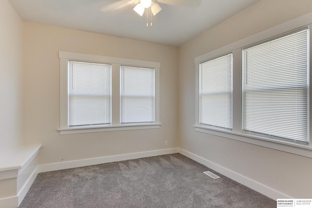 carpeted empty room with ceiling fan