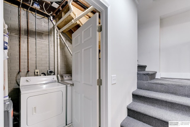 laundry area featuring washing machine and clothes dryer