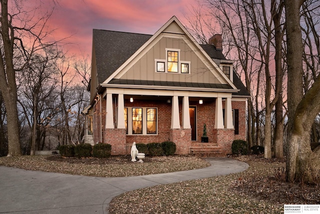 view of front of property featuring covered porch