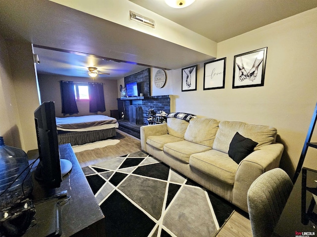 living room featuring a fireplace and hardwood / wood-style floors