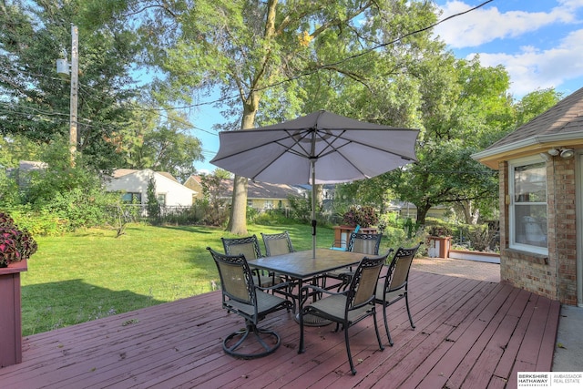 wooden terrace with a yard