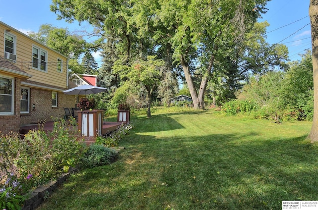 view of yard with a deck