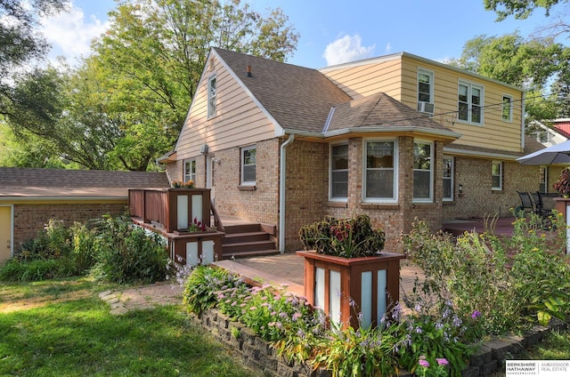 view of front property featuring cooling unit and a wooden deck