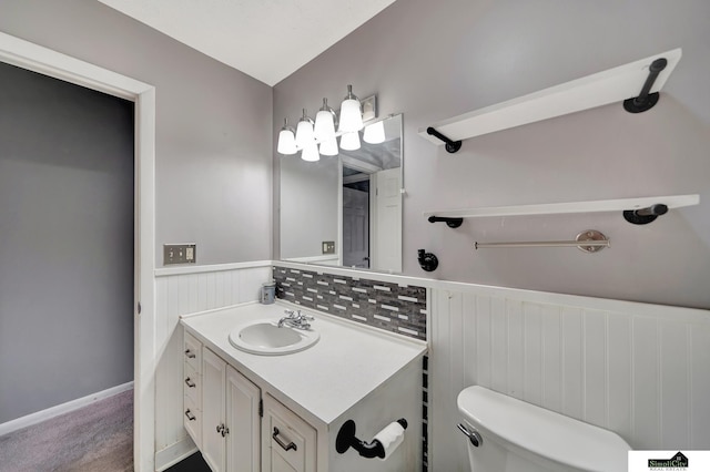 bathroom featuring toilet and vanity