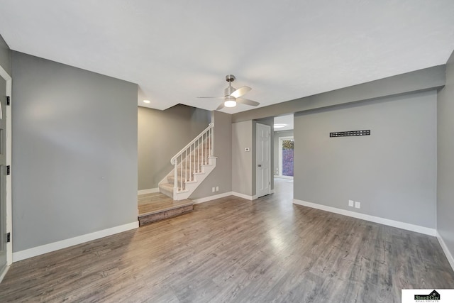 spare room featuring ceiling fan and hardwood / wood-style flooring