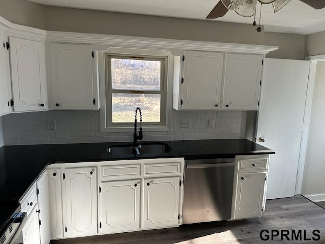 kitchen featuring white cabinetry, stainless steel dishwasher, backsplash, and sink