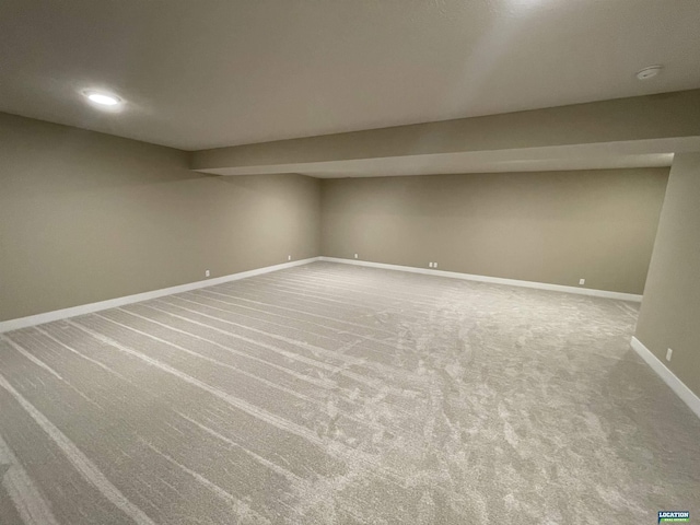 finished basement featuring carpet flooring and baseboards