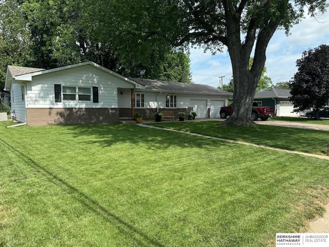 ranch-style house with a garage and a front yard