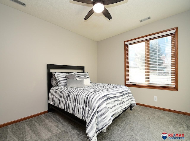 bedroom with ceiling fan and carpet