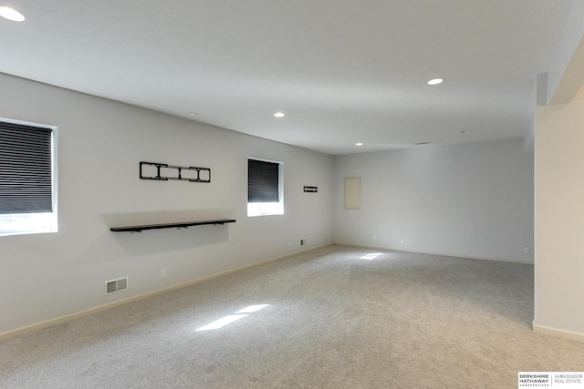 empty room featuring light carpet