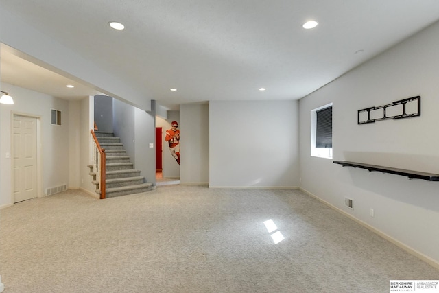 basement featuring light carpet