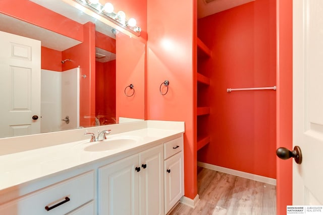 bathroom with vanity and hardwood / wood-style floors