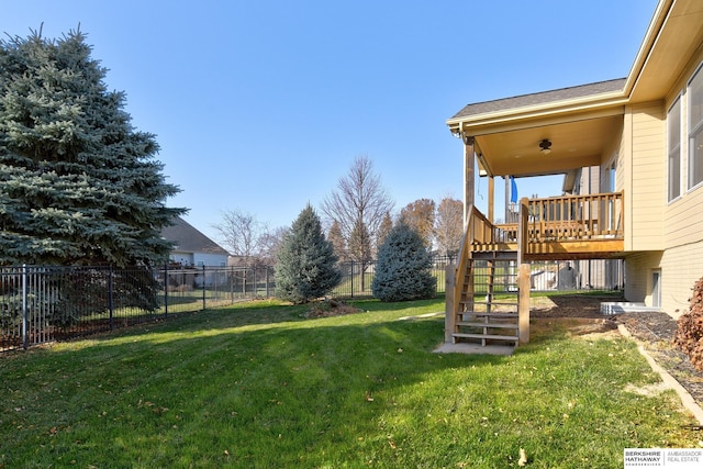 view of yard with a wooden deck