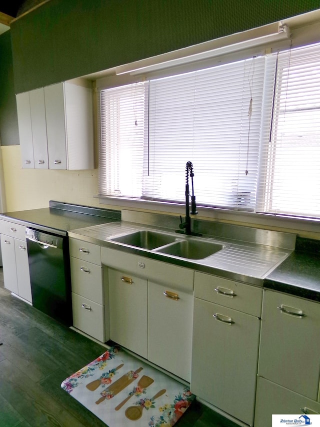 kitchen featuring a sink, white cabinets, stainless steel countertops, and black dishwasher