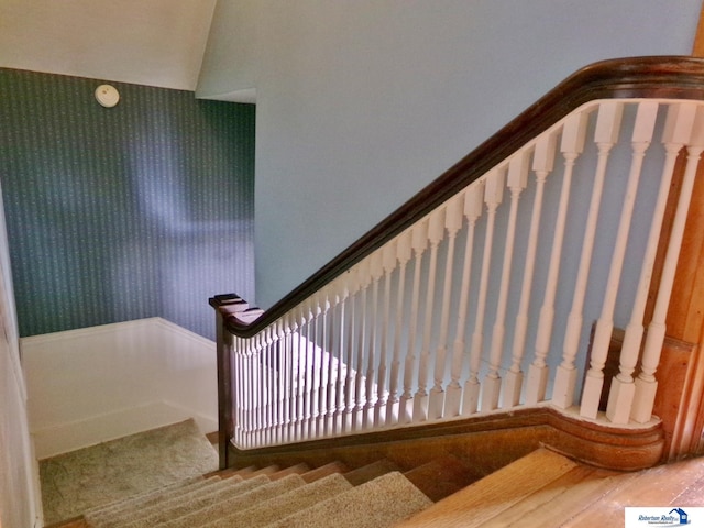 stairs with wood finished floors