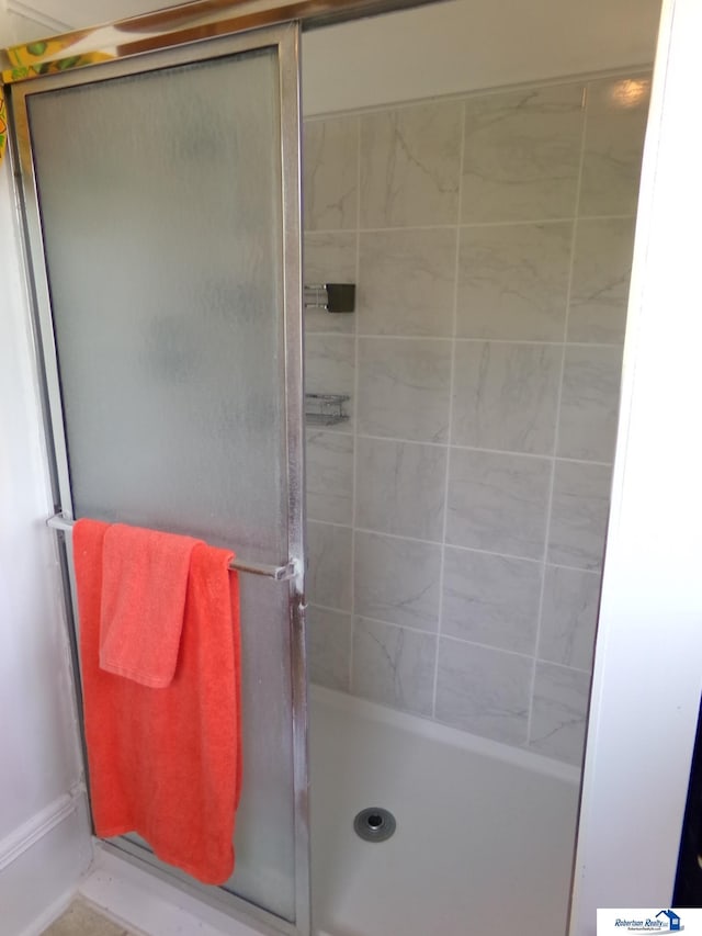 bathroom with a shower stall