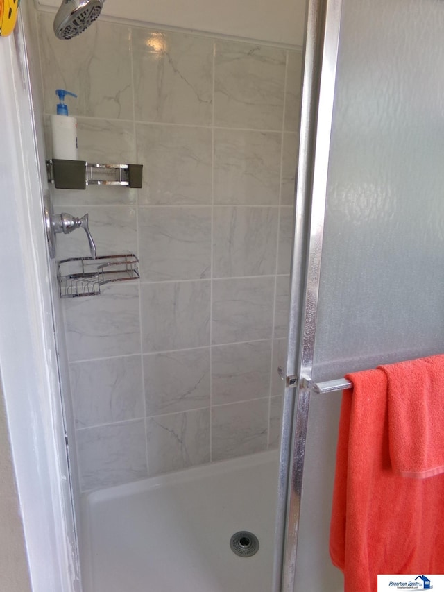 bathroom featuring a stall shower