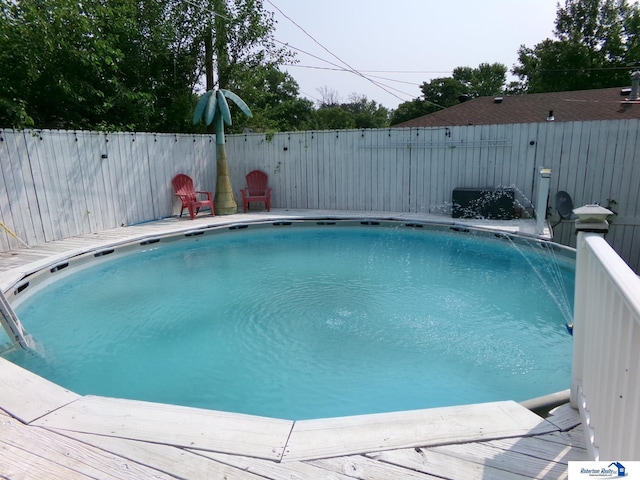 view of swimming pool with fence and a fenced in pool