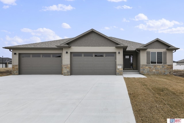 view of front of property with a front yard and a garage